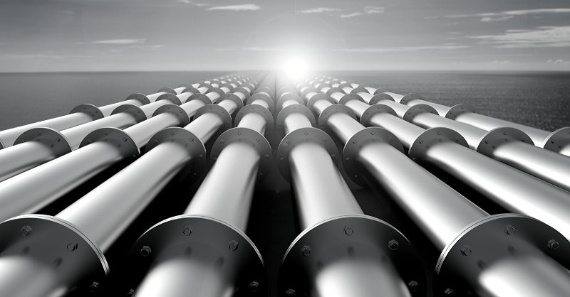 Photo of pipelines stretchign the horizon.