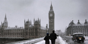 Photo of a couple walking on a London street in winter.