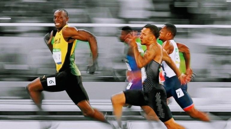 Photo of Usain Bolt running in the 100-meter dash, on his way to another win.